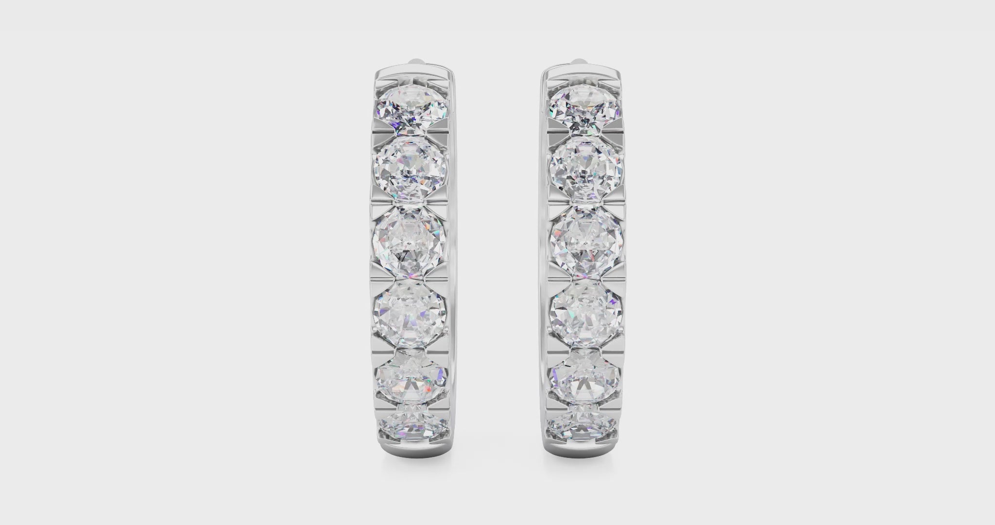 Video of white gold pavé huggie hoops