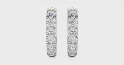 Video of white gold pavé huggie hoops