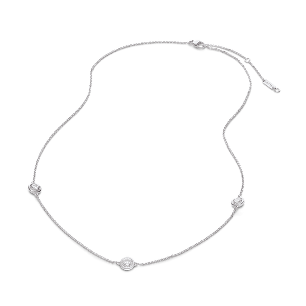 Overview of white gold 0.75 carat total weight bezel station pendant