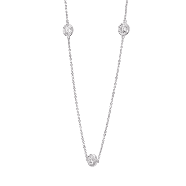 Side view of white gold 0.75 carat total weight bezel station pendant