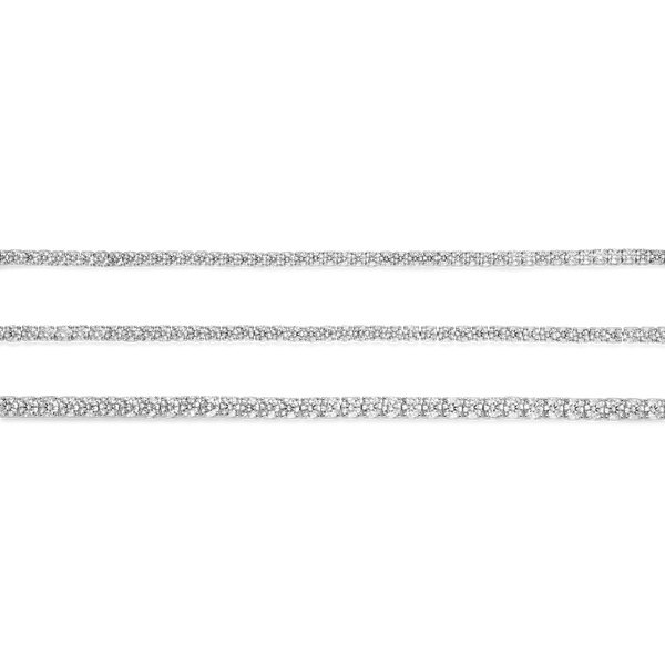 Group shot of white gold tennis bracelets to show comparison of small, medium and large diamond size